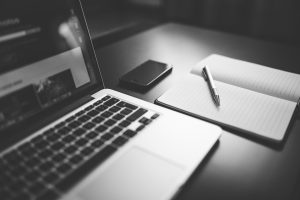 organized digital workspace with laptop and smartphone